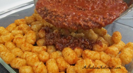 adding-sauce-to-sloppy-tots adding-sauce-to-sloppy-tots