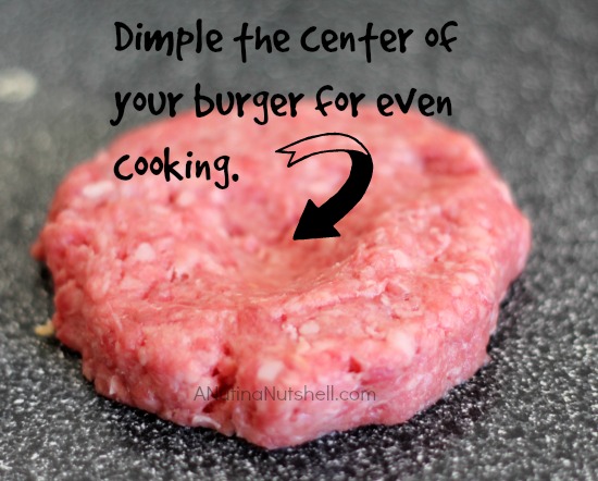 dimple center of burger for even cooking